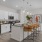 Apartment kitchen with white cabinetry